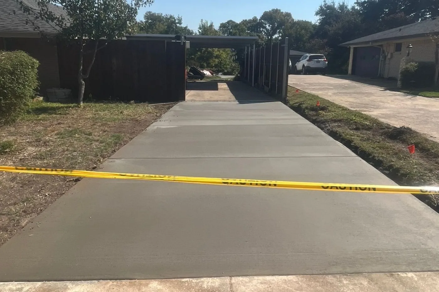 Finished wide residential concrete driveway by Billy's Concrete